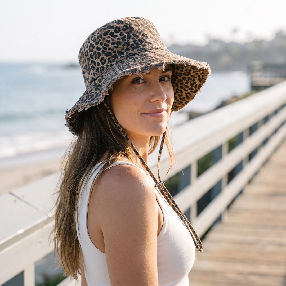 Women's wide brim bucket hat for effective sun protection during summer outdoor activities.