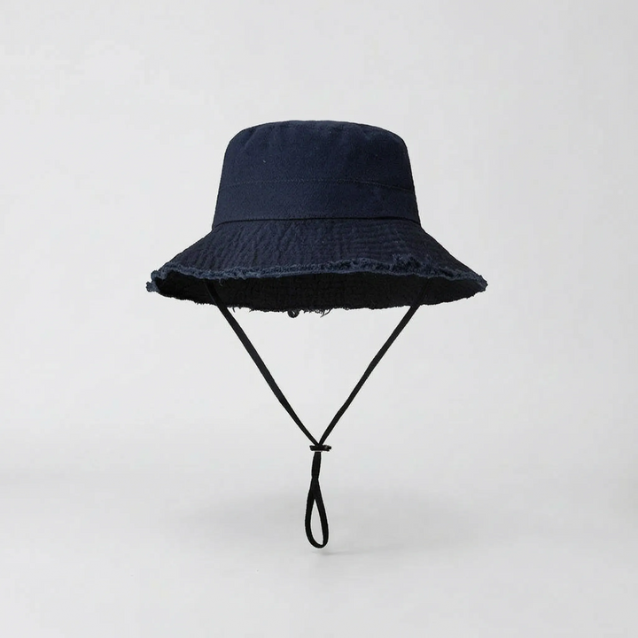 Women's solid color wide brim bucket hat with durable fabric, ensures stylish sun protection.