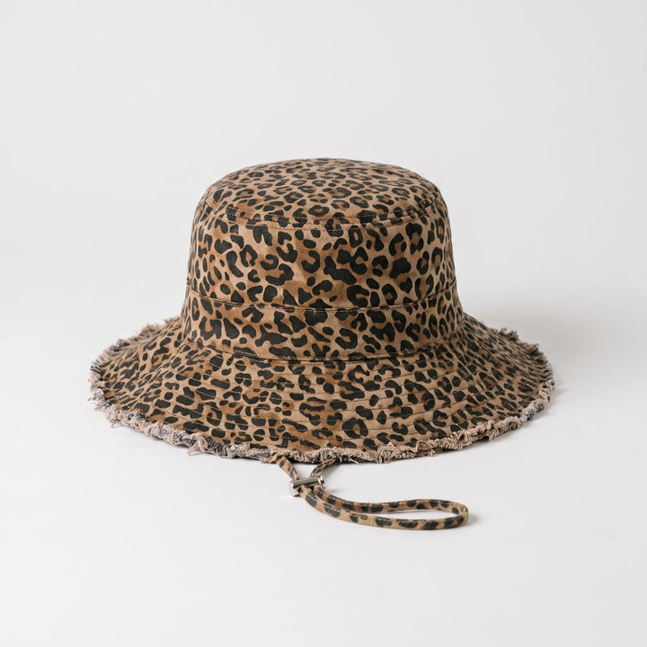 Stylish women's wide brim bucket hat with frayed edge, perfect for beach days & sun protection.