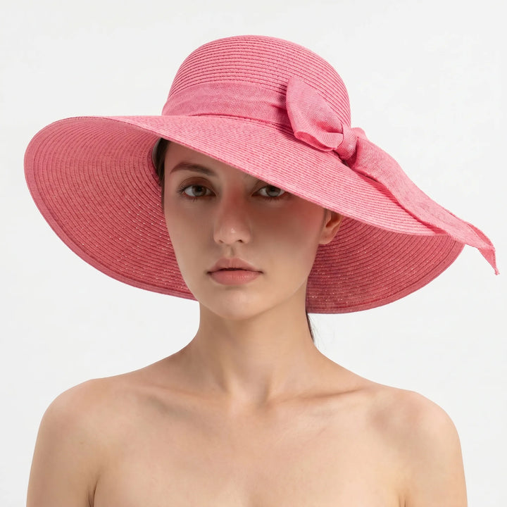 Chic women's wide brim hat, designed for sun protection and easy folding for vacation.