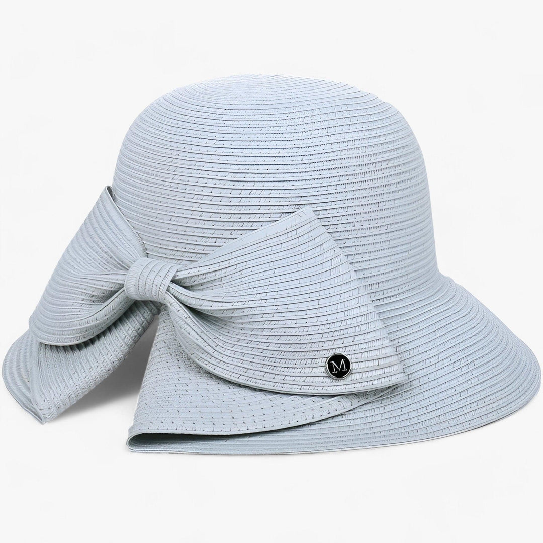 Women's wide brim khaki sun hat, stylish straw design for ultimate UV protection at the beach or travel.
