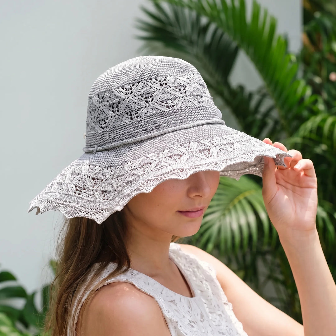 Women's wide brim sun hat for ultimate UV protection. Perfect for beach, garden, & travel.