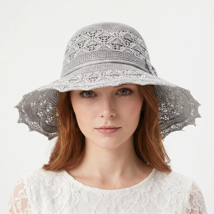 Stylish women's wide brim sun hat, packable & foldable. Ideal for summer vacation & beachwear.