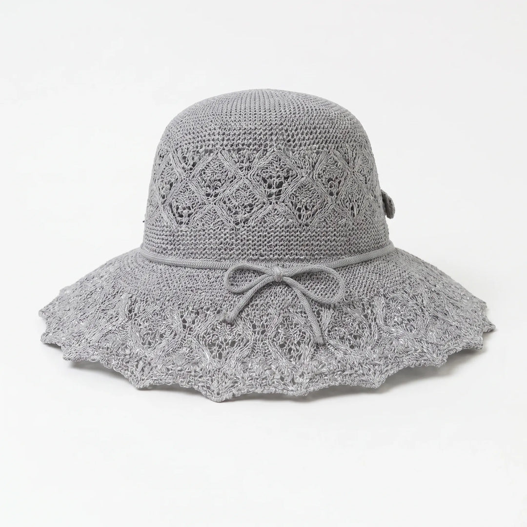 Women's packable wide brim sun hat, offering excellent UV shade for vacation & beach adventures.