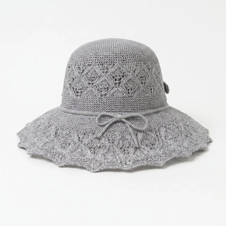 Women's packable wide brim sun hat, offering excellent UV shade for vacation & beach adventures.