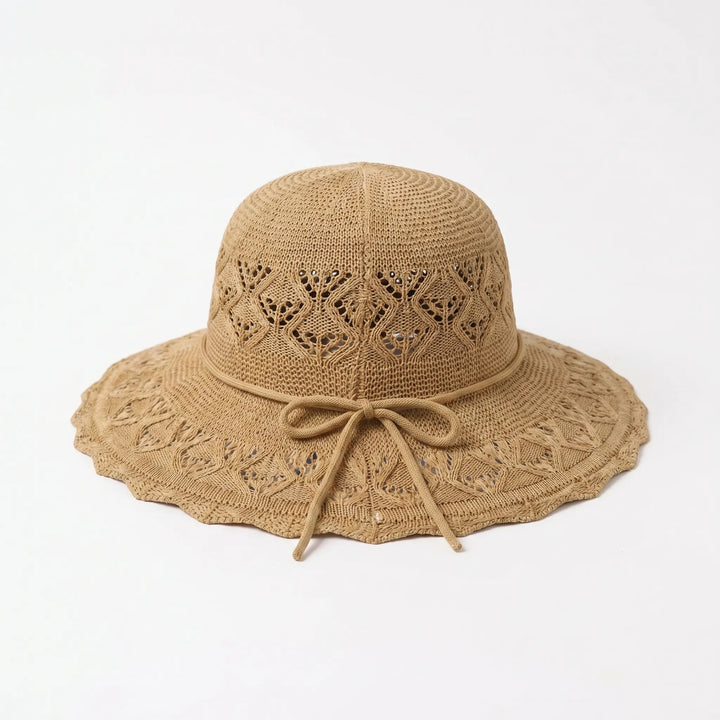 Elegant women's wide brim sun hat, designed for optimal sun protection and summer fashion.