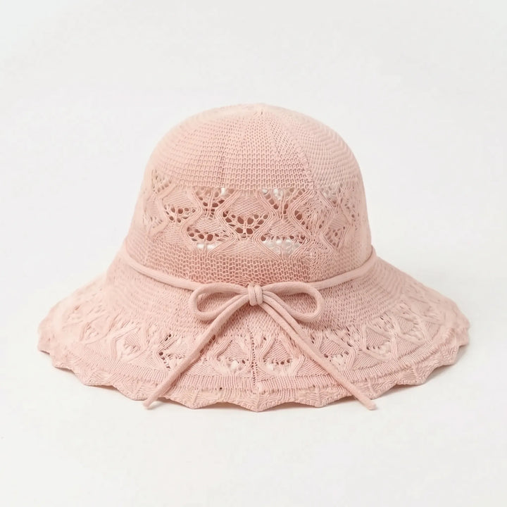 Foldable women's wide brim sun hat, combining practical UV protection with chic summer style.