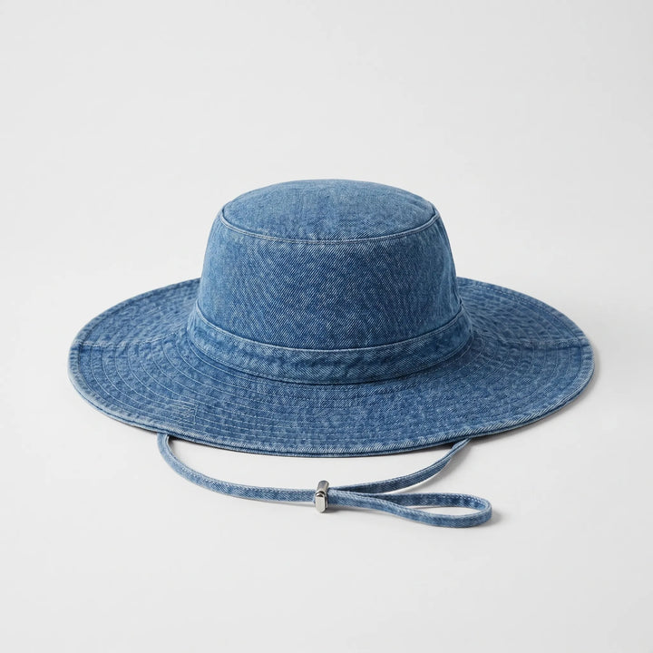 Light blue women's wide brim sun hat, adjustable & foldable bucket hat, perfect for beach, travel, & sun protection.