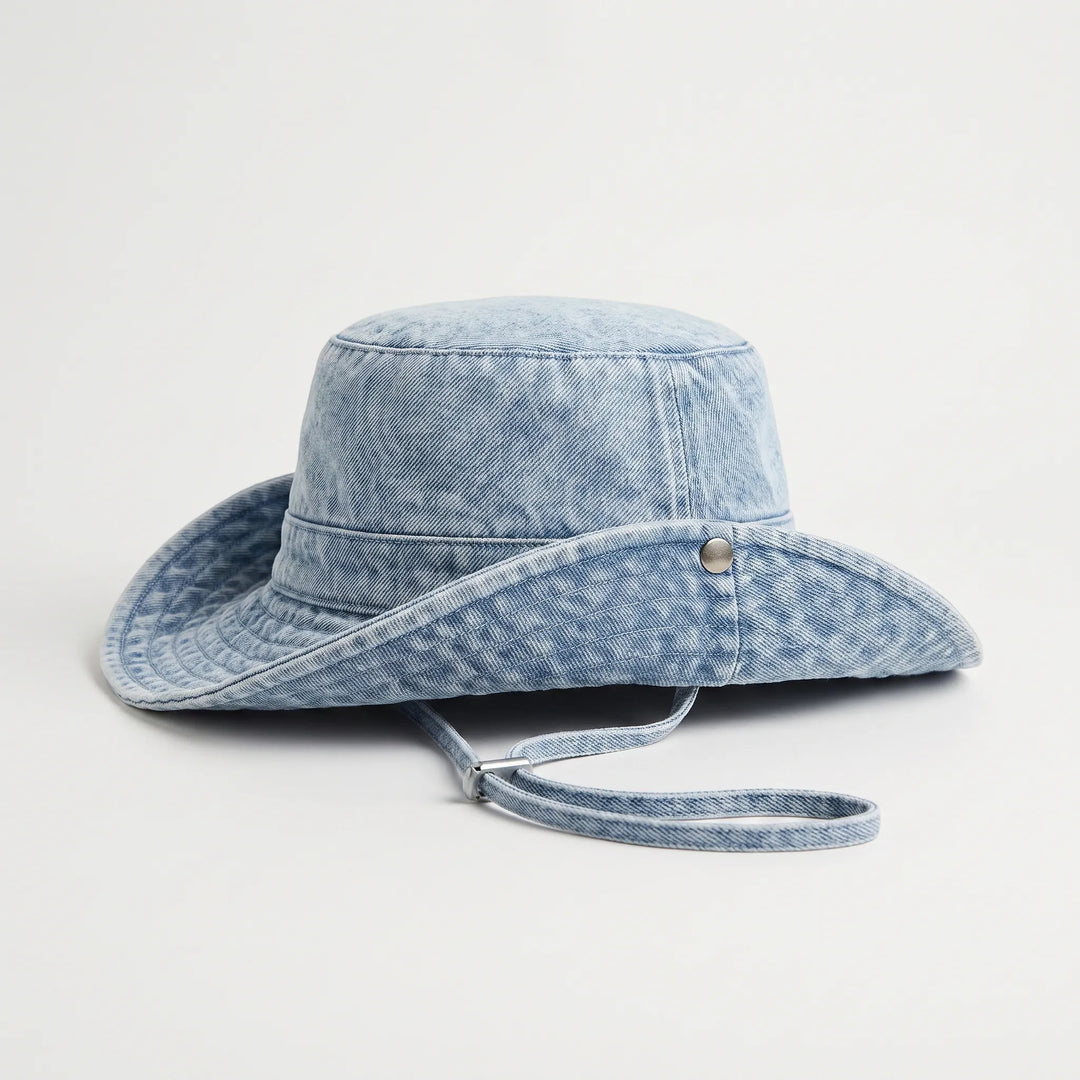 Foldable women's wide brim bucket hat, adjustable for easy travel & sun protection. Stylish summer beach & outdoor hat.