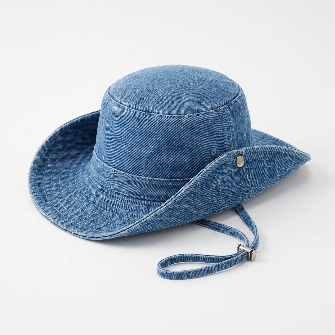 Stylish black women's wide brim sun hat, adjustable bucket hat for outdoor adventures, beach days, & summer travel.