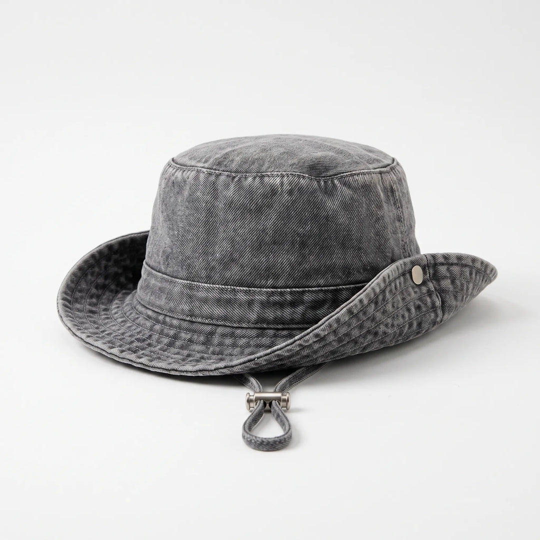 Elegant women's wide brim bucket hat, adjustable & foldable for stylish sun protection on beach trips & outdoor adventures.