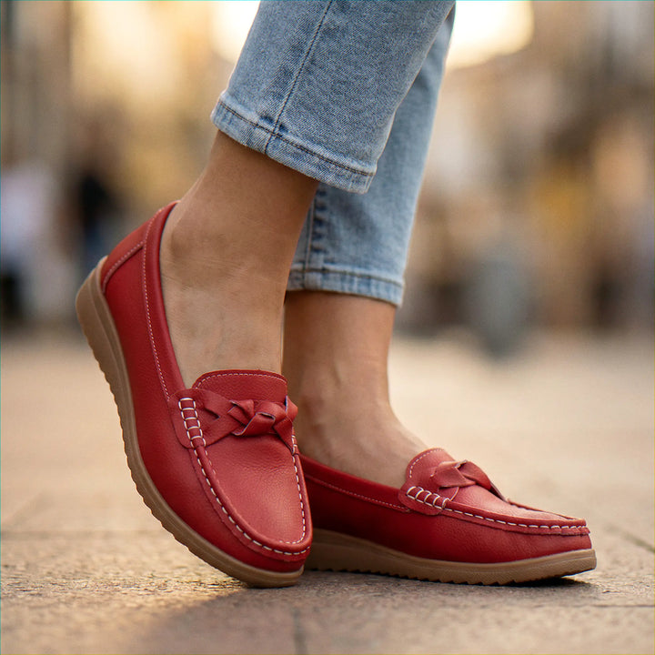Back view of women's comfortable orthopedic shoes, designed as wide fit loafers with arch support.