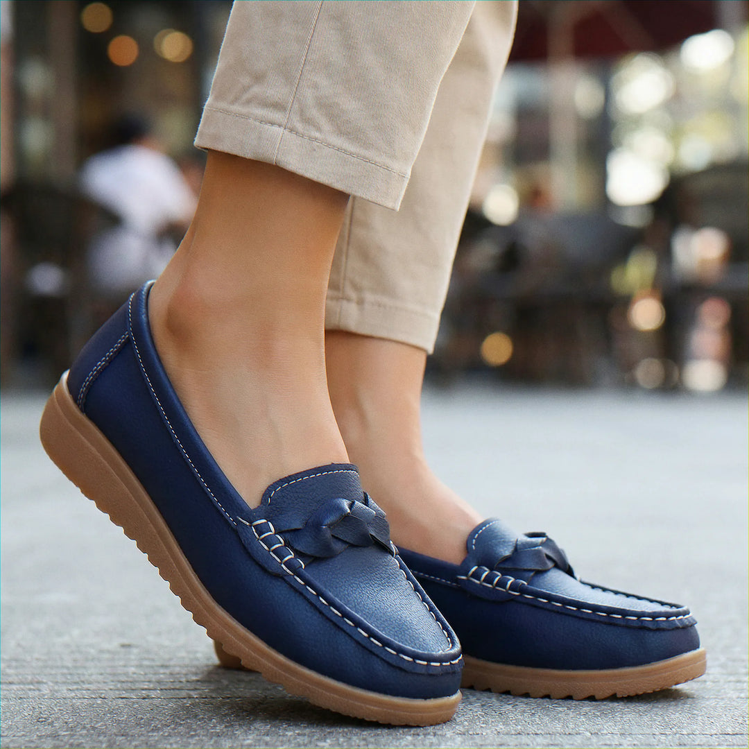 Dark-colored wide fit women's orthopedic loafers, offering easy slip-on functionality and arch support.