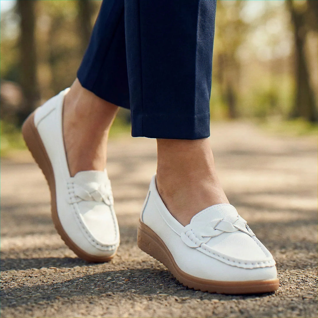 Close-up on the roomy toe box of women's wide fit loafers, orthopedic slip-ons with arch support.