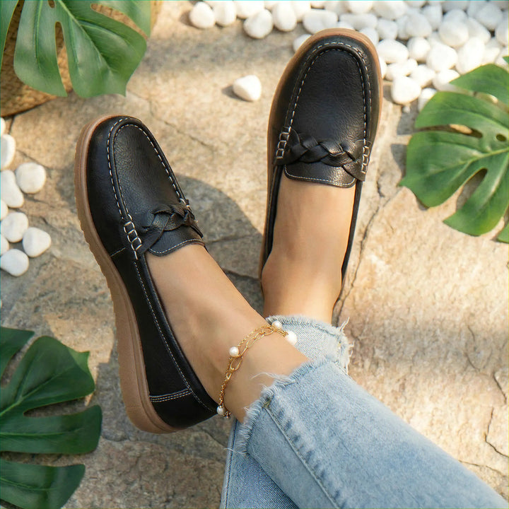 Women's wide fit slip-on shoes, designed as orthopedic loafers with superior arch support for walking.