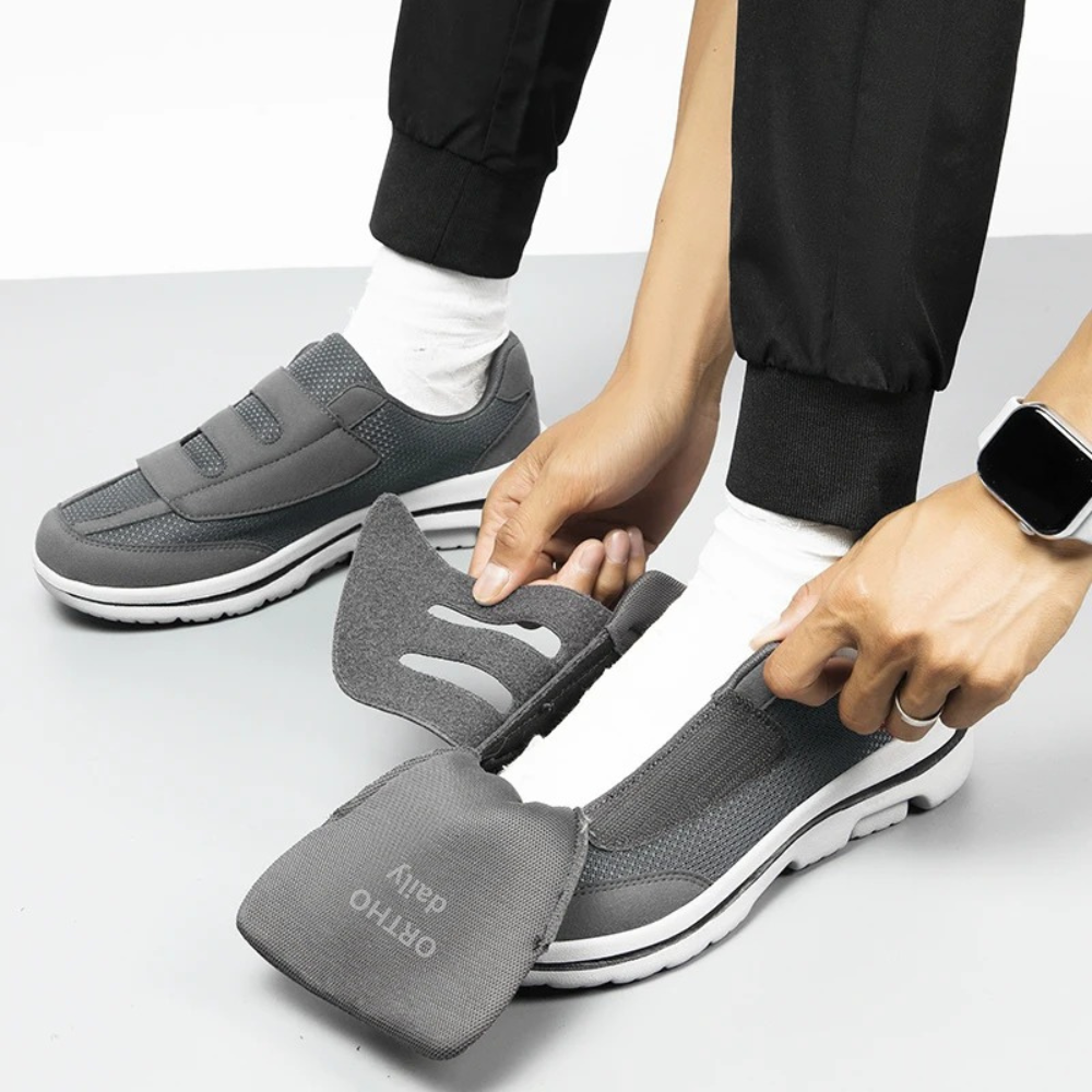 Women's wide fit orthopedic slip-on shoes on foot, demonstrating adjustable comfort and superior foot support.