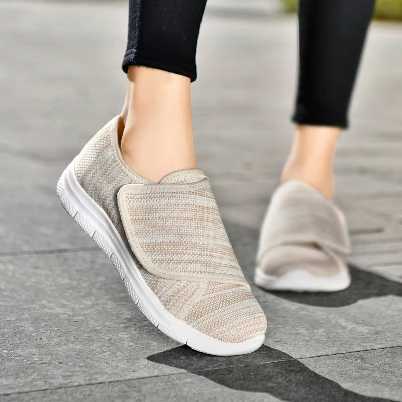 Women's wide fit walking sneakers with adjustable closures, ensuring comfort, support, and lightweight daily wear.