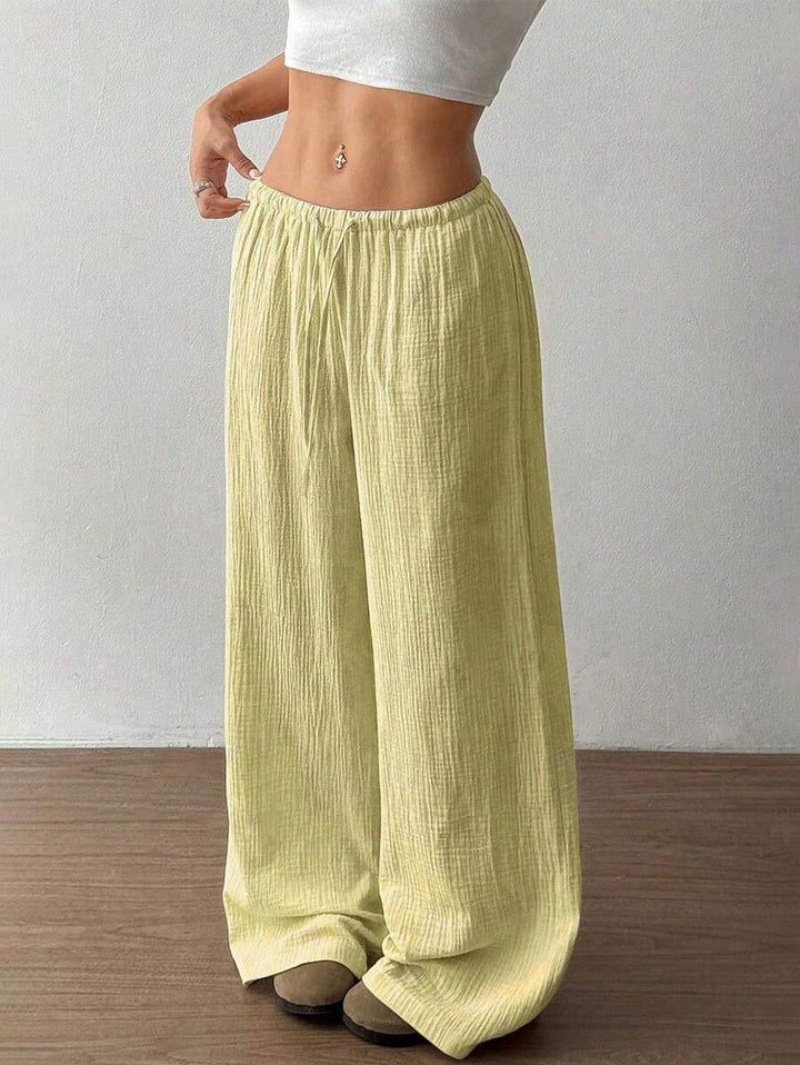 Lightweight women's wide leg summer pants, crinkle texture fabric, with a stylish drawstring waist.