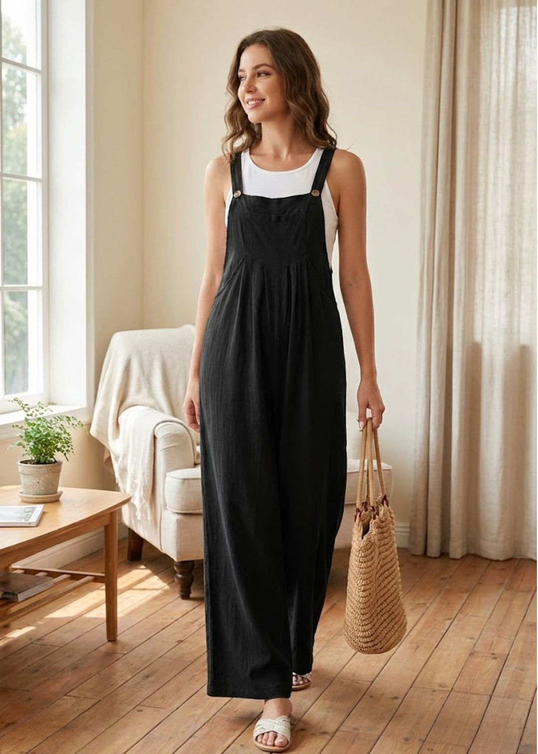 Women's wide-leg jumpsuit with adjustable button straps, perfect for casual summer wear.