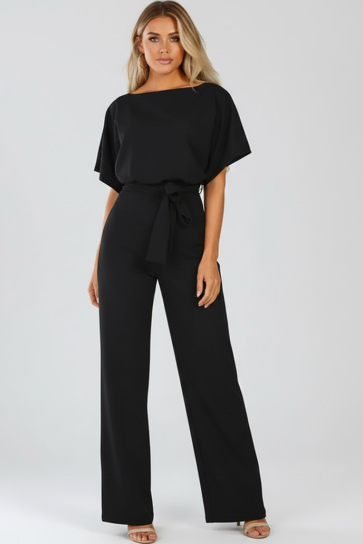Back view: Women's versatile wide leg short sleeve jumpsuit. Belt adds a tailored, elegant silhouette.