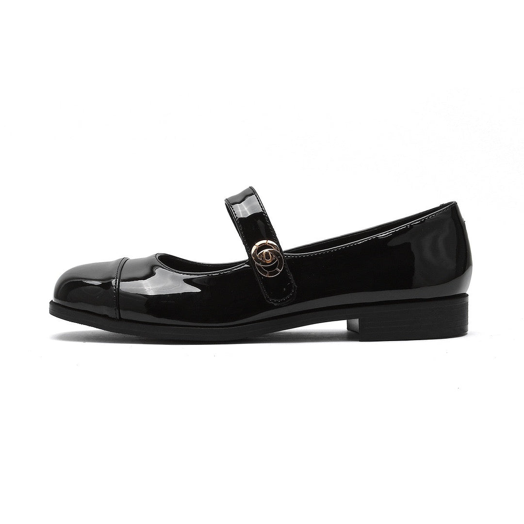 Modern women's Mary Jane flats, wide toe box, arch support, sleek design.