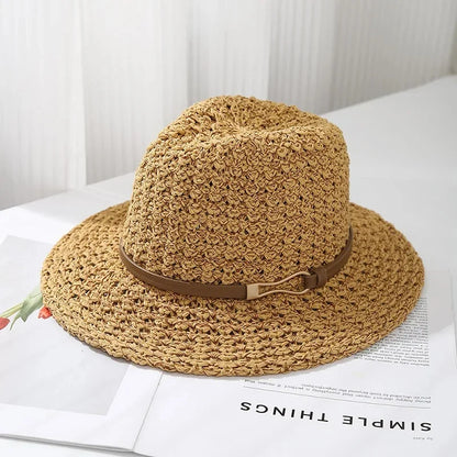 Women's woven fedora sun hat with a wide brim and faux leather band; an essential summer beach accessory.