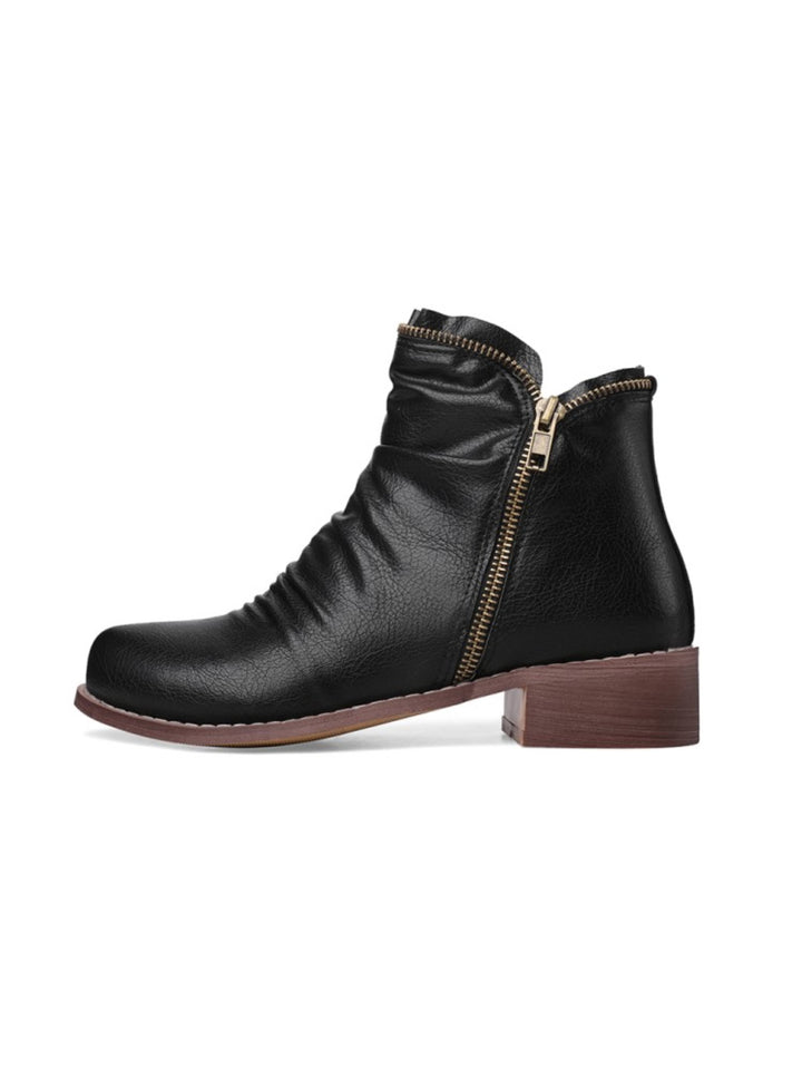Stylish women's black Western ankle boots with a low heel and double zippers, perfect for fall fashion.
