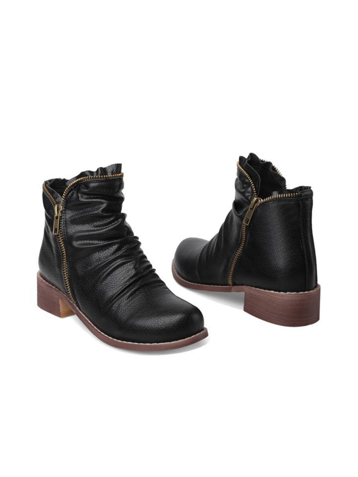 Textured black women's wrinkled ankle boots with a comfortable low heel and convenient double zip design.