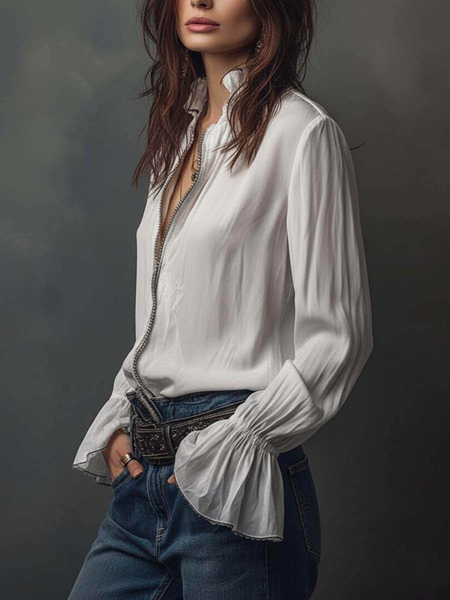 Stylish women's zip-front top featuring long sleeves & fashionable bell cuffs.