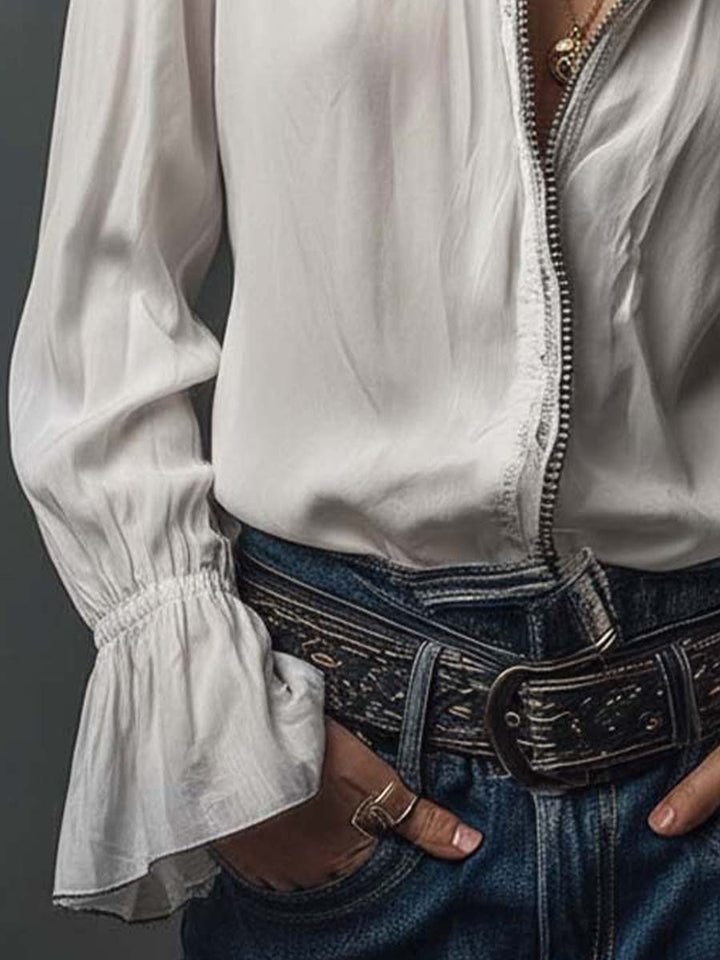Elegant women's blouse with a full zip front & sophisticated bell cuffs.