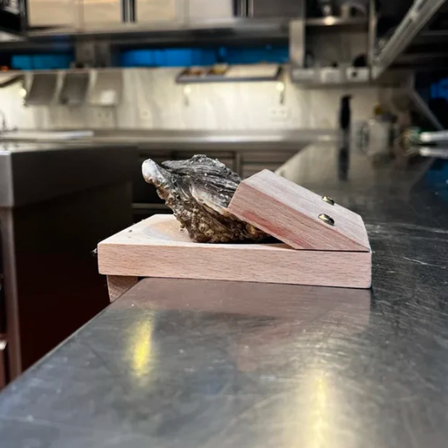 Durable wooden oyster shucker clamp, ideal for secure & easy shucking seafood.