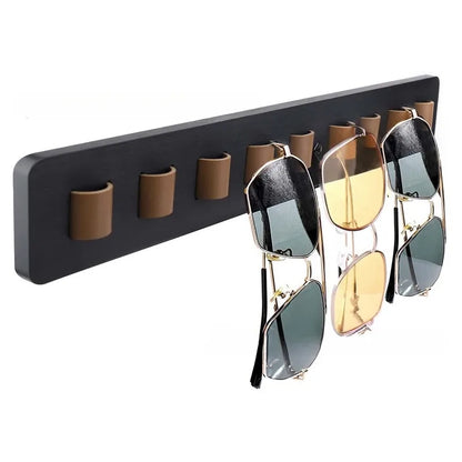 Stylish wooden eyewear holder, wall-mounted to beautifully display sunglasses and eyeglasses. Space-saving.