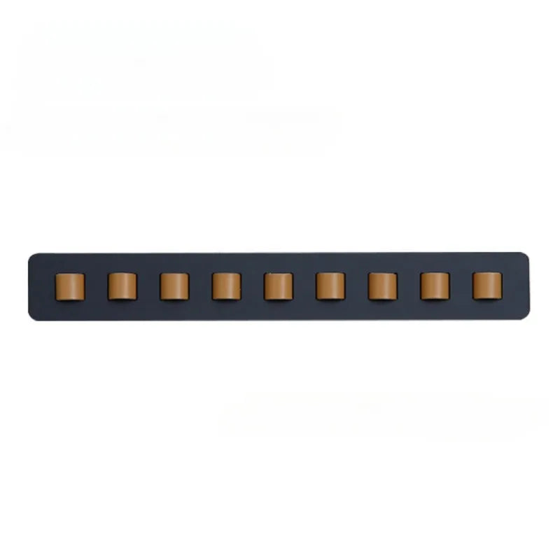 Handcrafted wooden wall mount for glasses, featuring a sleek, space-saving design. Ideal eyewear storage.