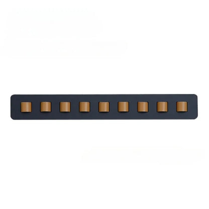 Handcrafted wooden wall mount for glasses, featuring a sleek, space-saving design. Ideal eyewear storage.