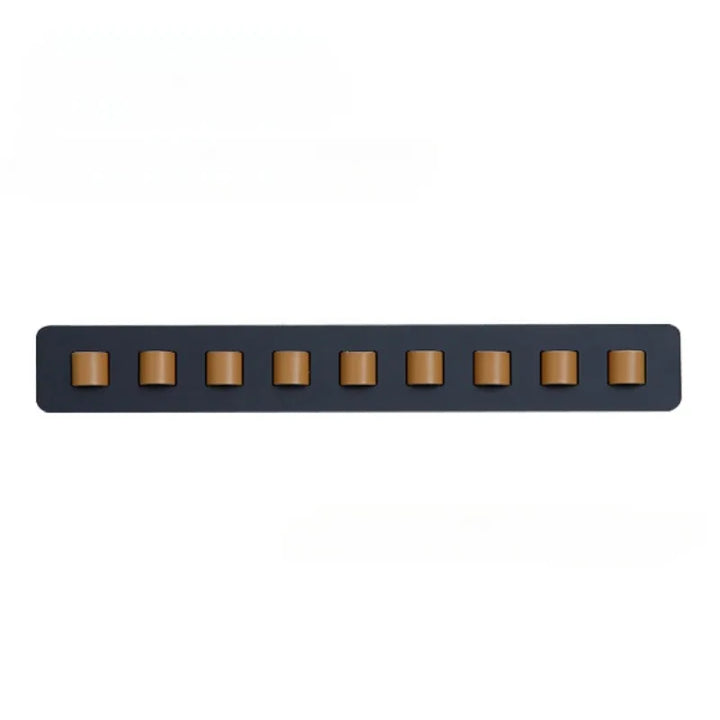 Handcrafted wooden wall mount for glasses, featuring a sleek, space-saving design. Ideal eyewear storage.