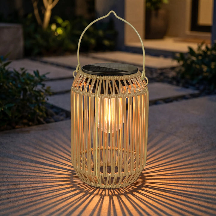 Woven solar outdoor lantern with warm LED light for garden patio decor, creating ambient lighting.