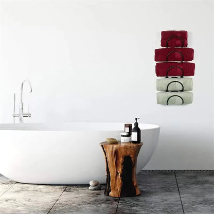 Decorative wrought iron multi-layer towel rack for bathrooms, offering ample wall-mounted storage and home decor.
