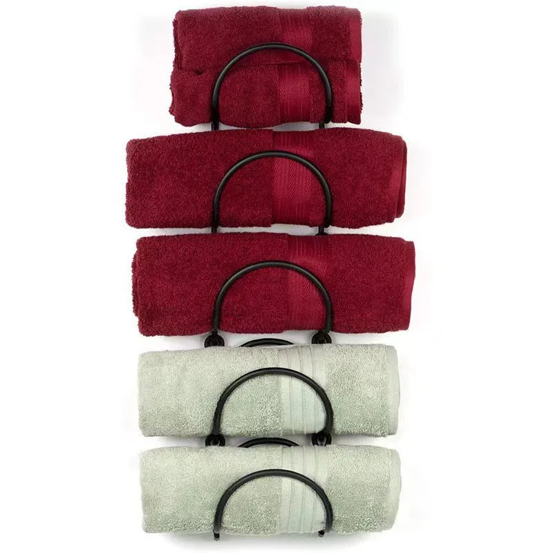 Durable wrought iron multi-layer towel rack, a chic wall-mounted solution for bathroom organization and decor.